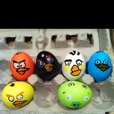 six angry birds painted on eggs in an egg carton, all different colors and sizes