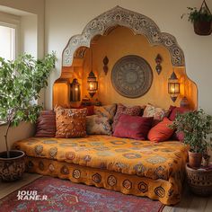 a large bed sitting next to a potted plant