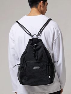 This is a casual and unique bag by BSMT that is made out of high quality and sturdy material. With distinctive mood of the design and comfortable wear, you can style it for your casual daily outfit.- Adjustable string and stopper on side and top- Miimal logo print detail- Casual and trendy mood Urban Nylon Chest Bag For Outdoor, Functional Nylon Chest Bag, Versatile Nylon Gym Backpack, Versatile Black Gym Bag With Functional Pockets, Casual Nylon Backpack Shoulder Bag, Nylon Chest Bag Backpack For Streetwear, Versatile Nylon Backpack Gym Bag, Casual Nylon Bags For Streetwear, Practical Nylon Chest Bag For Streetwear