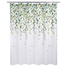 a shower curtain with green leaves on the top and bottom, in front of a white background