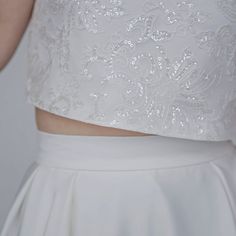 "The elegant and classy \"Aiko\" crop top features sparkly sequined lace mounted onto a matte ivory bridal satin, and it has wide fit cap sleeves, open triangle back and clear buttons. It is only available in shown ivory color. We recommend wearing backless bra with this top. Pair this top with any or our bridal bottoms: https://www.etsy.com/shop/WardrobeByDulcinea?ref=l2-shop-info-name%C2%A7ion_id&section_id=19306135 We would be needing these measurements from you and here are the instructi Bridal Crop Top, Bridal Tops, Backless Bra, Sequin Crop Top, Ivory Bridal, Wedding Top, Ivory Color, Bridal Wedding, Wedding Outfit