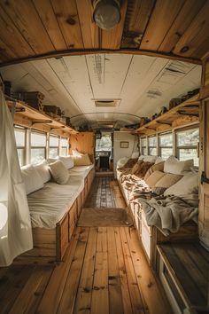 there are many beds in the inside of this bus