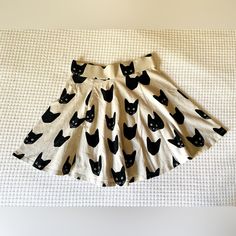 Super Unique Find! Never Worn, But Received As Gift In Gently Preloved Condition. Tags Cut Out. From Consignment Shop In Woodstock Ny. See Measurement For Fit/Length. 6” Zip In Back Swirls Out Wide, Wear Boyshorts Underneath ;) Color Is A Light Cream With Black Cat Design Open To Reasonable Offers Or Bundles Cat Skirt, Black Cat Design, Vintage Black Cat, Woodstock Ny, Consignment Shops, Light Cream, Cat Clothes, Cat Design, Woodstock