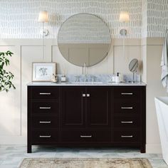 a bathroom with two sinks, a mirror and a rug on the floor in front of it