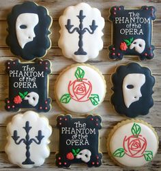 decorated cookies are arranged in the shape of skulls and roses with words that read, the phantom of the opera