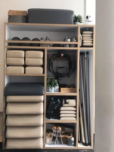 a shelf filled with lots of different types of furniture and decor on top of each other