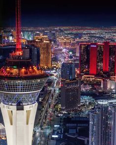 an aerial view of the las vegas strip at night with skyscrapers and buildings lit up