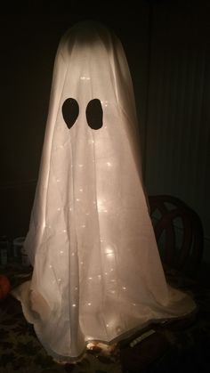 a white ghost with two black eyes on it's head