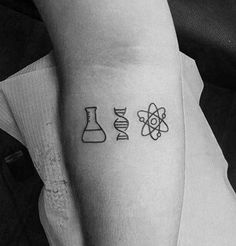 a black and white photo of an arm with three different tattoos on it, one is for science