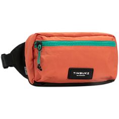 an orange fanny bag with a black strap and green zippers on the front pocket