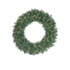 a green wreath with white lights on the top and bottom, in front of a white background