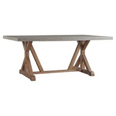 the table is made out of wood and has a concrete top with two crossed legs