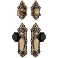 an antique style door handle set with black knobs and two handles on each side