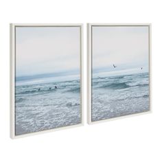 two framed pictures depicting surfers in the ocean on a cloudy day with birds flying overhead