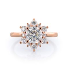 an 18k rose gold engagement ring with diamonds