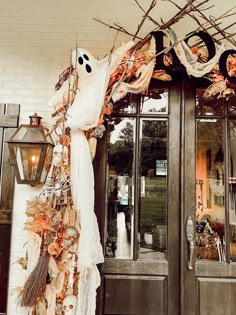 the front entrance to a store decorated for halloween