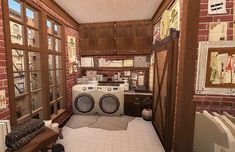 a laundry room with a washer and dryer sitting in it's center