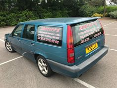 a blue van parked in a parking lot