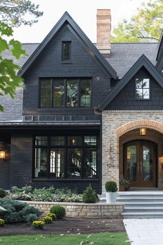 the front entrance to a large house with steps leading up to it's entry