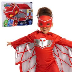 a young boy wearing a red costume and mask with wings on his chest, standing in front of a white background