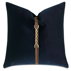 a blue pillow with a gold chain on the front and side, along with a white background