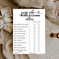 a bridals groom's question card next to wedding rings and ring boxes