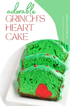 green cake with red sprinkles on it and the words, adorable grinch's heart cake