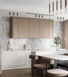 an elegant kitchen with marble walls and flooring