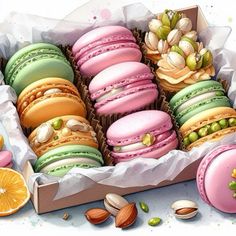 a box filled with lots of different colored macaroons