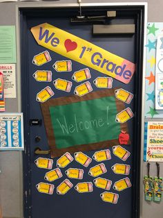 a classroom door decorated with school supplies and the words we love 1st grade written on it