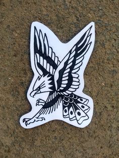 an eagle sticker sitting on the ground