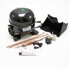 a black barbecue grill and accessories on a white background