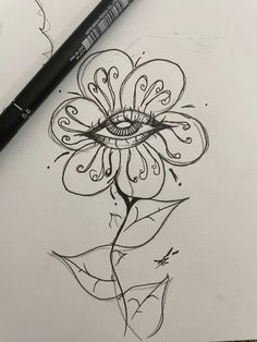 a drawing of a flower with an eye on it