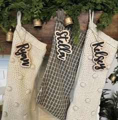 three stockings hanging from a christmas tree