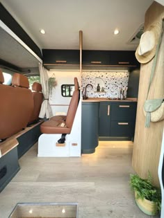 an interior view of a camper van with the door open and seats in place