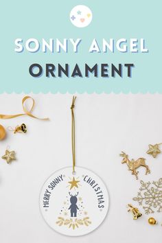 an ornament hanging from a christmas tree with ornaments around it and the words, sunny angel ornament