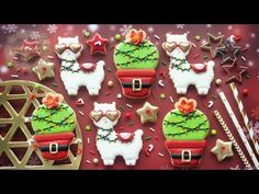 decorated christmas cookies are displayed on a table