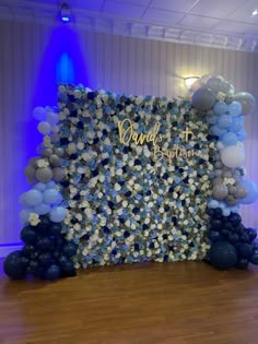 a backdrop made out of blue and white balloons