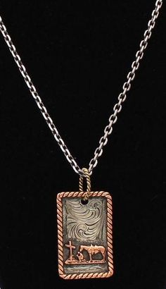 a necklace that has a small square pendant on it