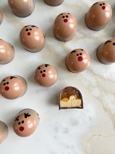 there are many chocolate eggs with faces on them