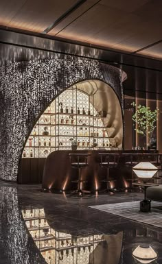 the interior of a restaurant with large circular chandelier