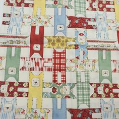 a patchwork quilt with many different colors and patterns