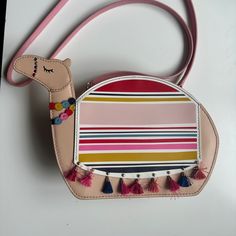 This Kate Spade Camel Purse Is In Great Shape. It Has Been Used But Has No Visible Scuffs And Still Has All Its Original Bits. The Tassels Are A Little Scruffy (See Pics) But Are Still Cute! The Bottom Of The Interior Is A Little Dingy (See Pic), But Interior Lining Is Still In Good Shape With No Rips Or Tears. Questions? Leave A Comment Below! Bags Kate Spade, Kate Spade Bags, Kate Spade Bag, Spice Things Up, Camel, Tassels, Kate Spade, Bag Lady, Purse