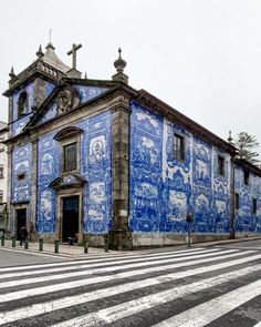 an old building with blue and white paint on it