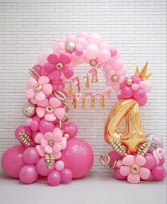 balloons are arranged in the shape of flowers and numbers