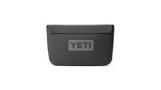 the yeti lunch box is shown in black and grey, with a gray logo on it