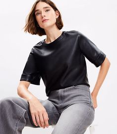 It's luxe, it's cool, it's forever flattering - this faux leather top is one you'll want to perfect every outfit with. Round neck. Short sleeves. Back button keyhole.,Bullet1:20 3/4" long,Imported:Imported,Fit:Fit: Classic — follows your contours with a little room,Length:Length: Abbreviated - hits at natural waist,Fabrication:Imitation Leather Coating : Polyurethane Back : 100% Polyester,Garment Care:Machine Washable Loft Petite Faux Leather Top Size Large Black Women's by Loft Size Petite - L Leather Top For Night Out In Fall, Leather Tops For Night Out In Fall, Edgy Faux Leather Tops For Fall, Edgy Leather Tops For Spring, Elegant Leather Tops For Night Out, Faux Leather Tops For Work In Spring, Faux Leather Tops For Spring Workwear, Faux Leather Top For Work In Spring, Casual Faux Leather Top For Night Out