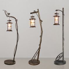 three lamps are standing next to each other