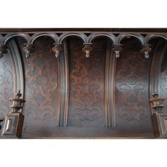 an ornately carved wooden shelf with candles on it