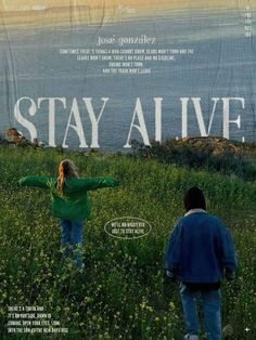 the movie poster for stay alive with two people standing in tall grass and looking out to sea